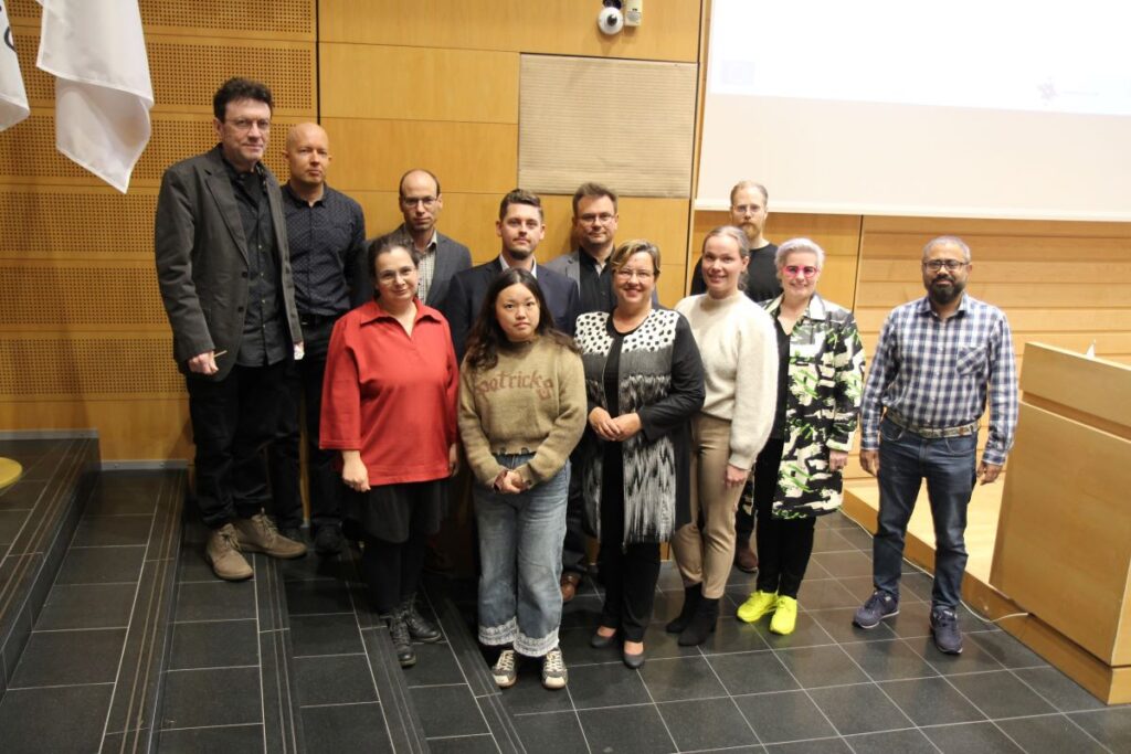 Many persons standing in the auditorium