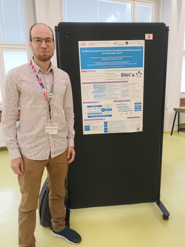 a man standing in front of a poster